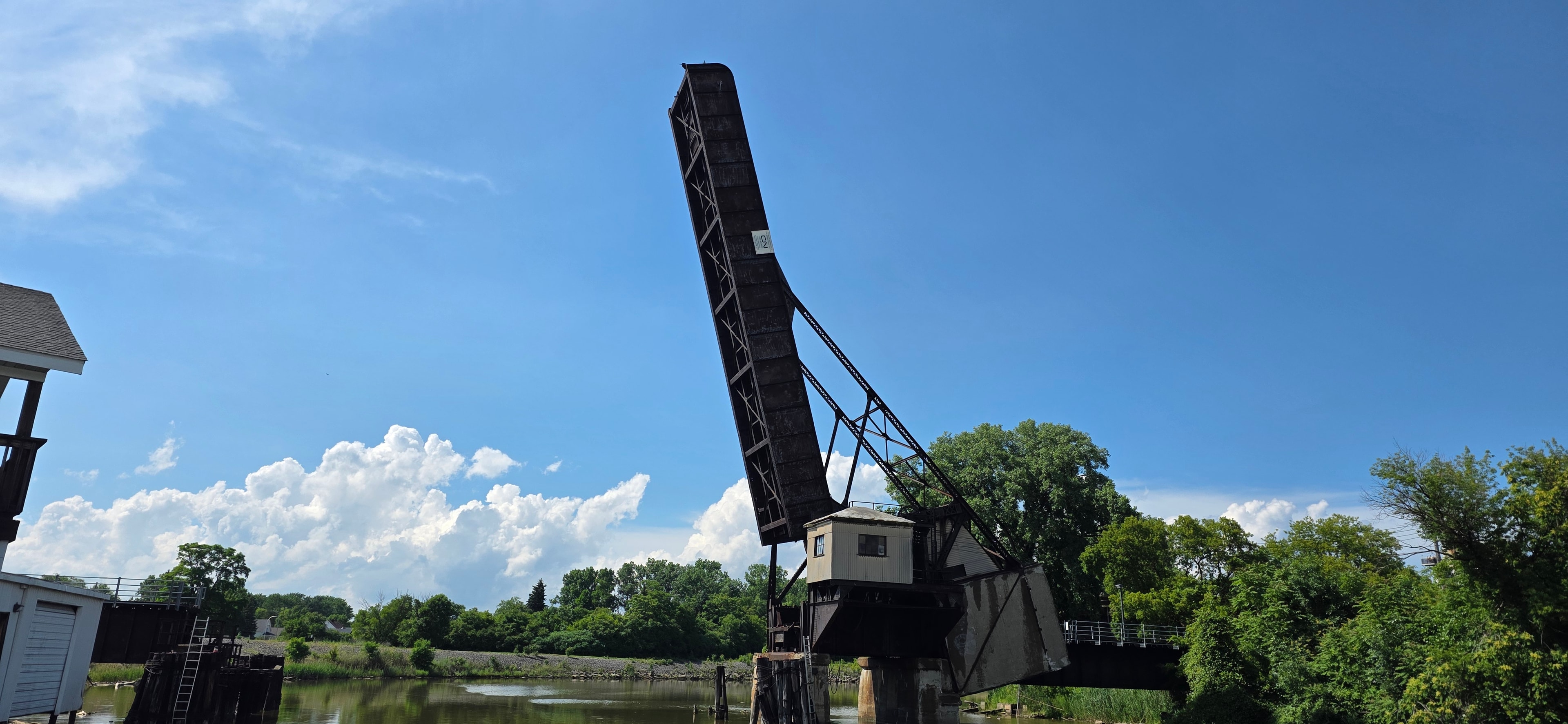 The Black River Bridge raised against a blue summer sky