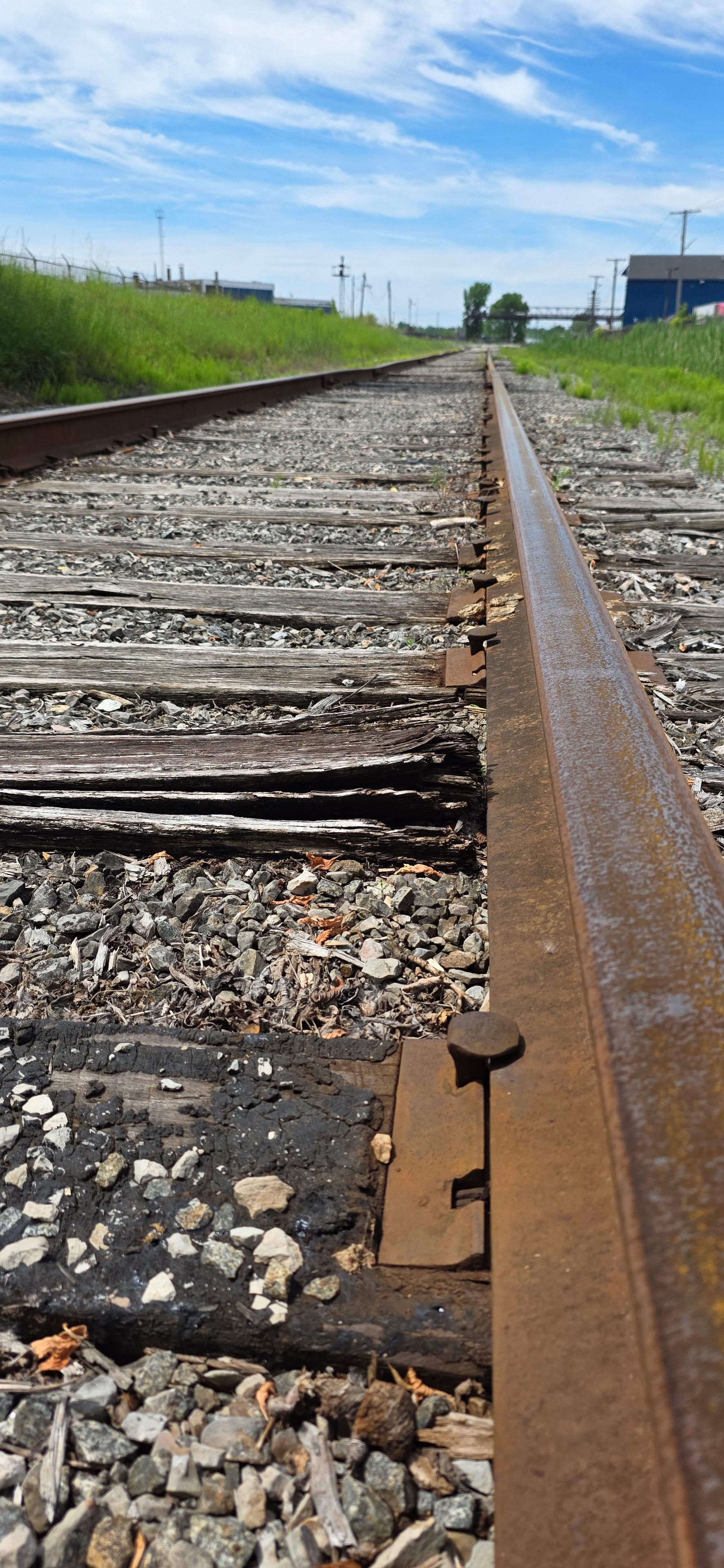 Weathered railroad tracks leading to the Black River Bridge
